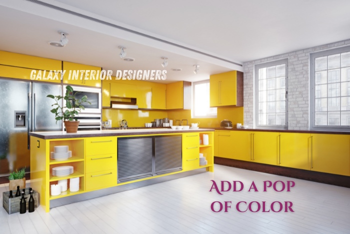 Modular kitchen design by Galaxy Interior Designers in Chennai, showcasing colorful and modern interiors that brighten up residential spaces