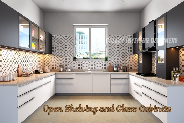 Modern modular kitchen with open shelving and glass cabinets by Galaxy Interior Designers in Chennai, showcasing stylish storage solutions